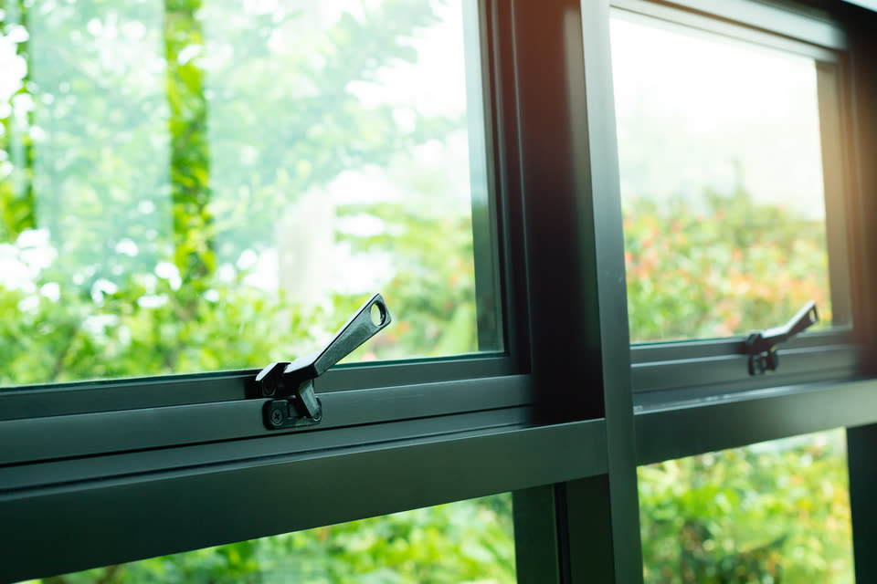 Close-up of a dark aluminium window opener