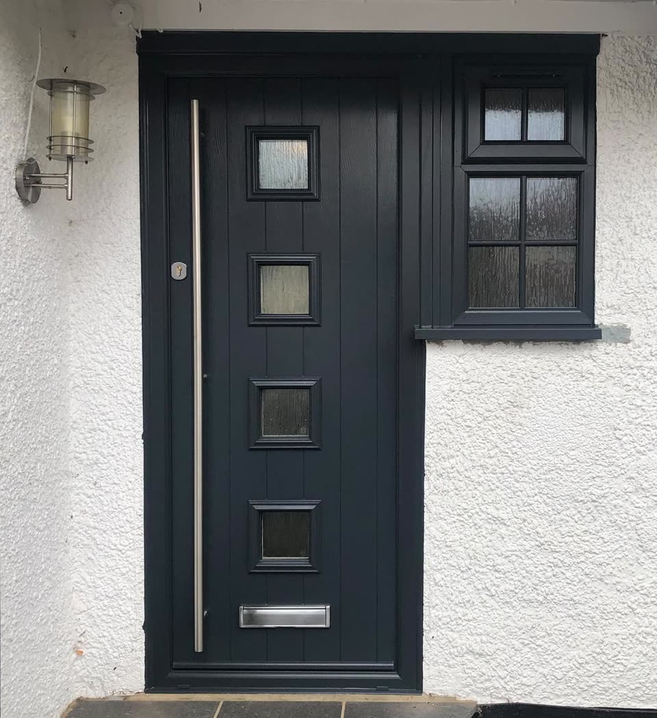 Anthracite grey contemporary front door with a matching side window