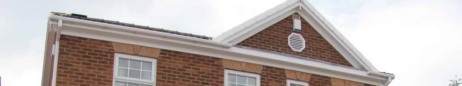 White uPVC fascias and bargeboards on a brick gable