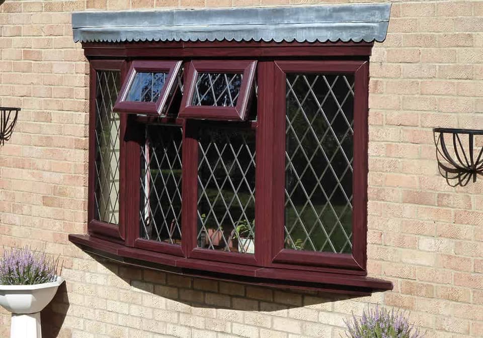 Rosewood uPVC bay window with diamond leaded glass
