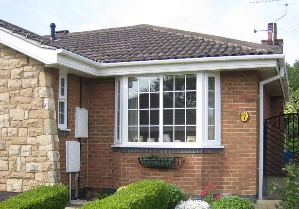 White uPVC bay window with Georgian bars on a bungalow