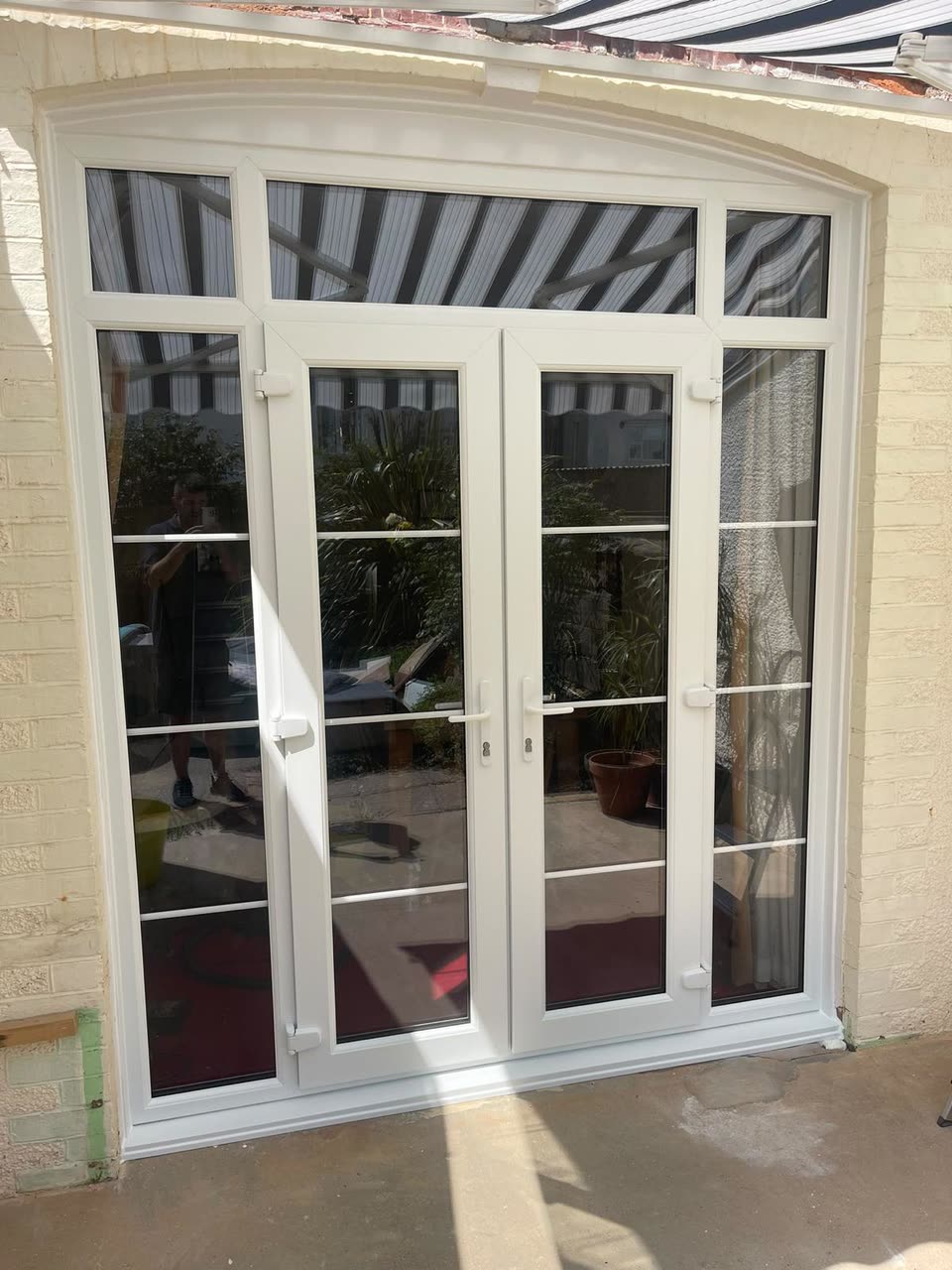 White French doors with side panels, top lights and Georgian bars